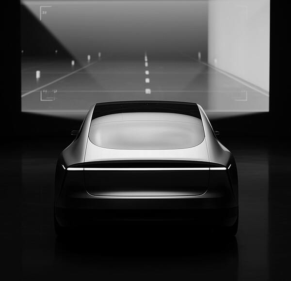 Vehicle in front of a screen with a roadway