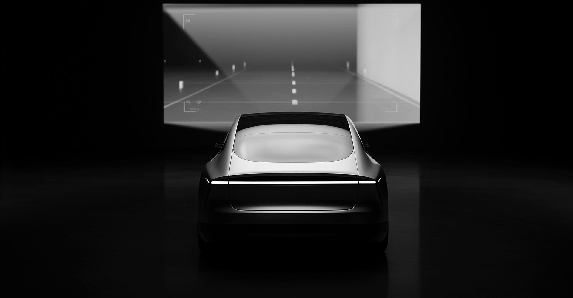 Fahrzeug vor einer Leinwand mit Fahrbahn